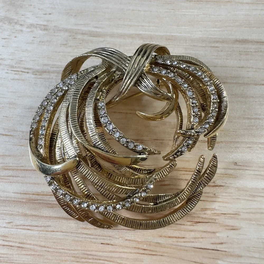 Vintage Monet Gold Tone Etched Swirl Rhinestone Brooch Signed BEAUTY